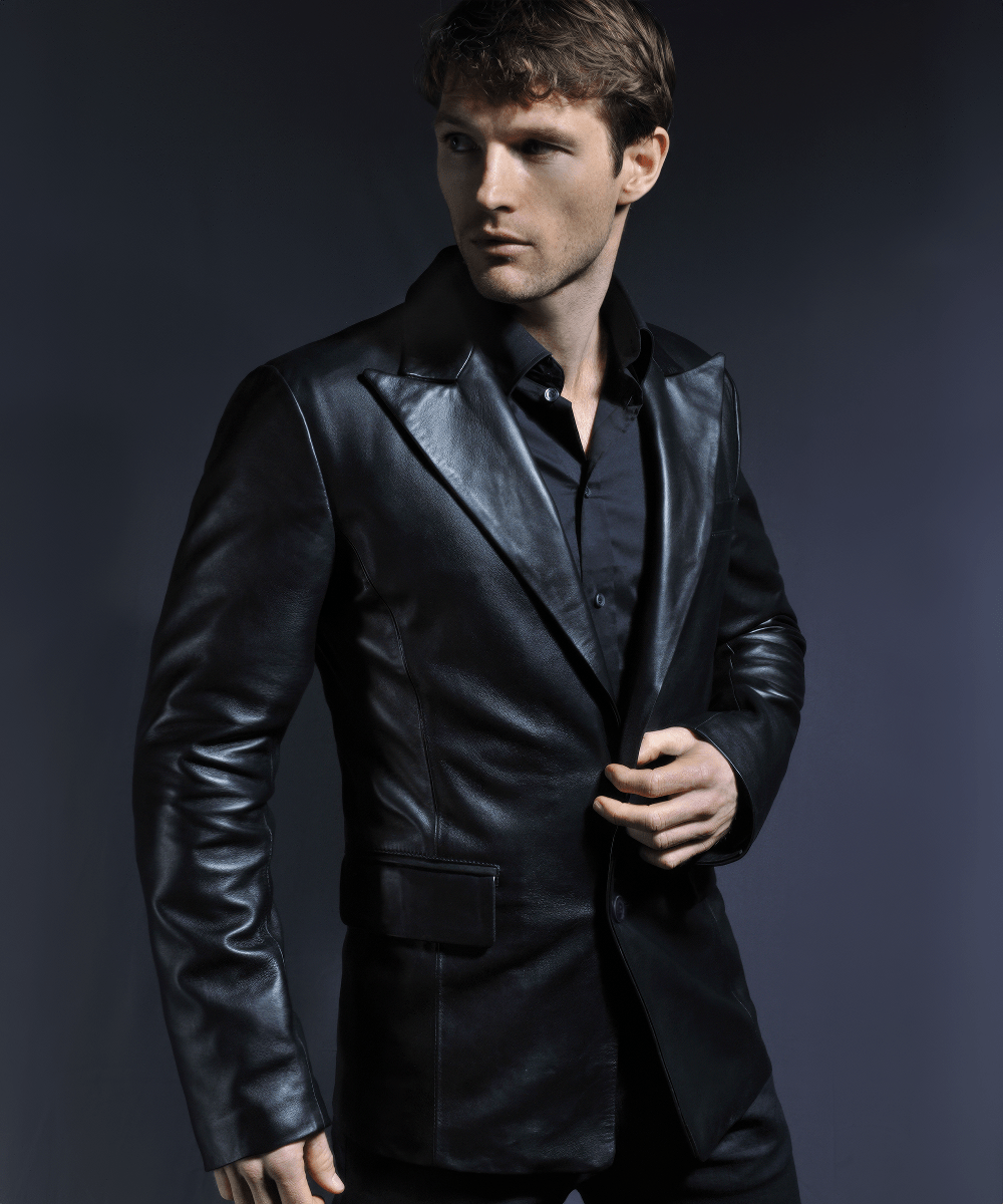 Model wearing black leather blazer with tailored fit and sharp classic lapel styling