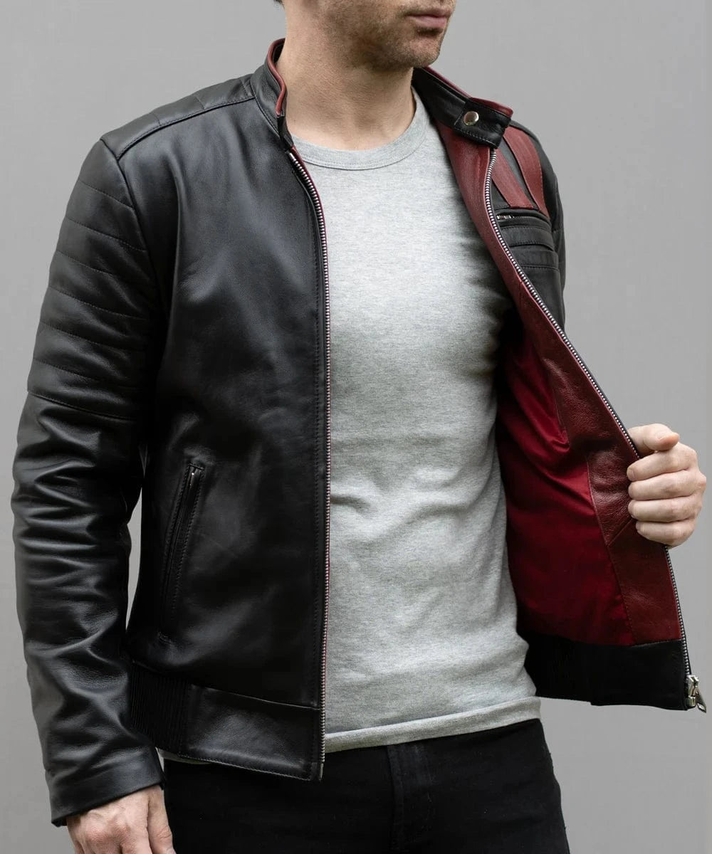 Model wearing vintage slim fit black leather cafe racer jacket with red stripe detailing and contrast red interior lining