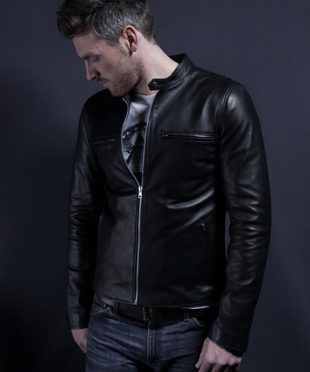 Model wearing black cafe racer leather jacket with zip front and stand collar