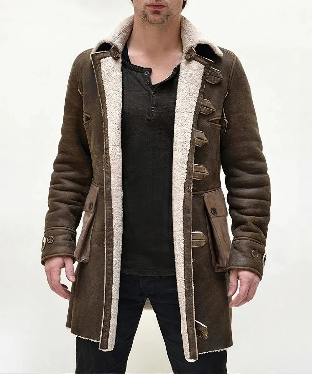 Model wearing brown Bane replica shearling coat with open front and oversized collar