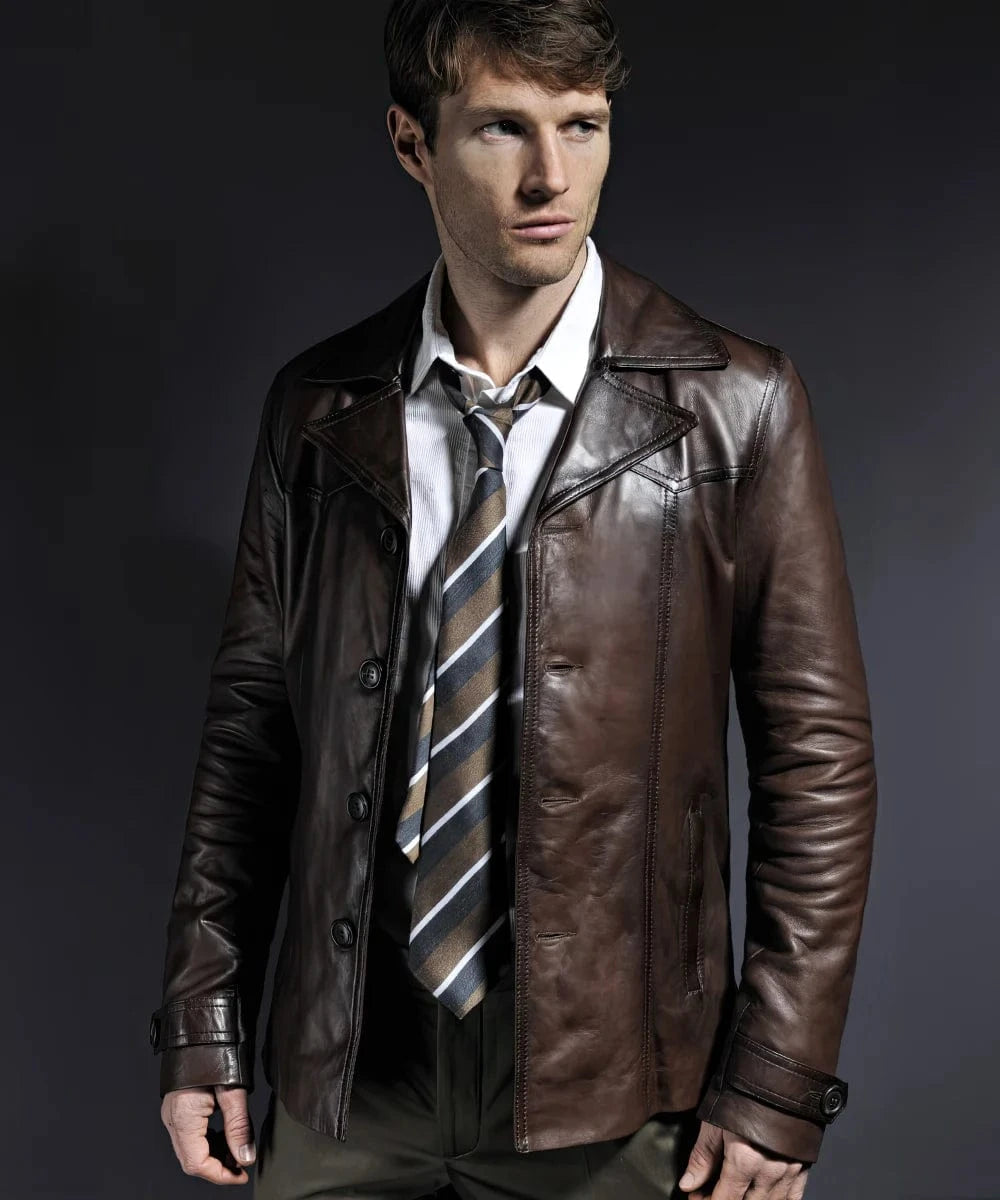 Model wearing vintage slim fit brown leather jacket with retro lapel styling and tailored button front design