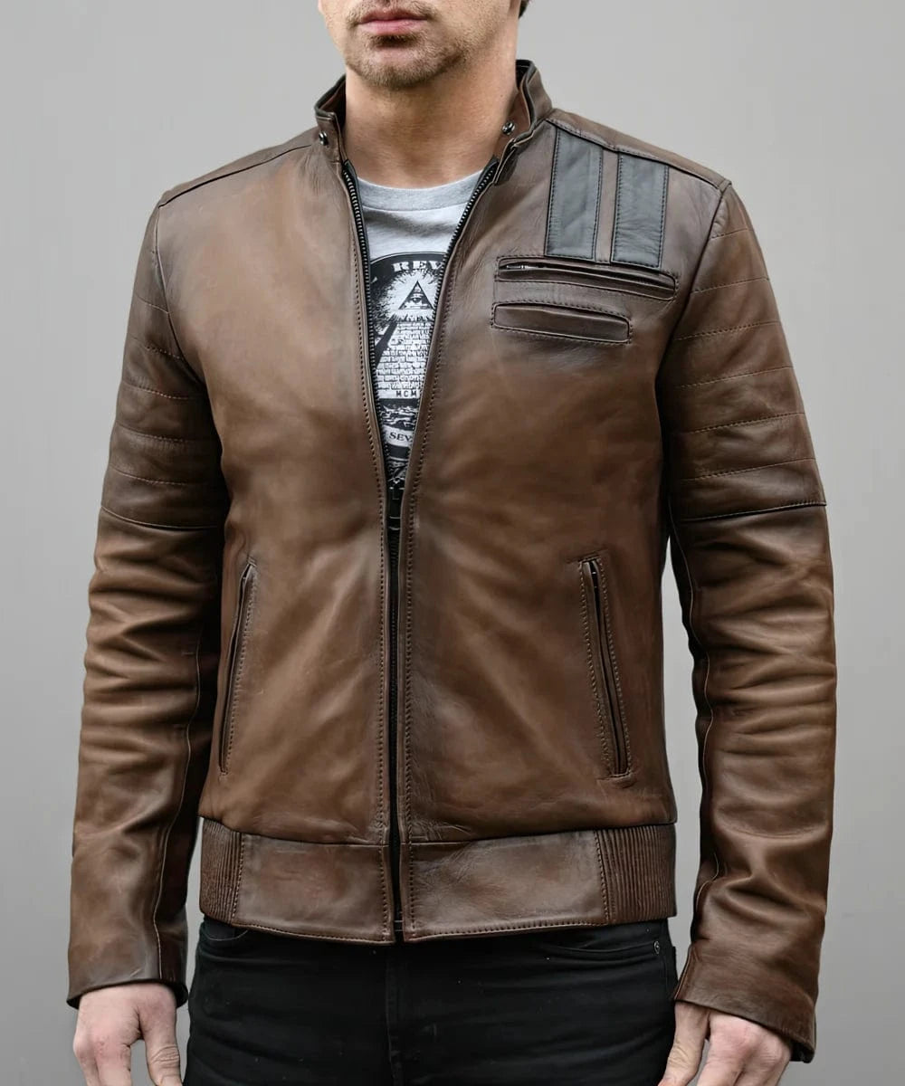 Model wearing vintage slim fit brown leather cafe racer jacket with biker inspired shoulder stripe detailing and zip chest pocket accents