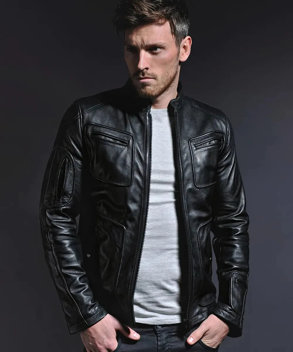 Male model wearing a black leather Kirk movie replica jacket with slim fit styling, band collar, zip front, and oversized chest pocket detailing