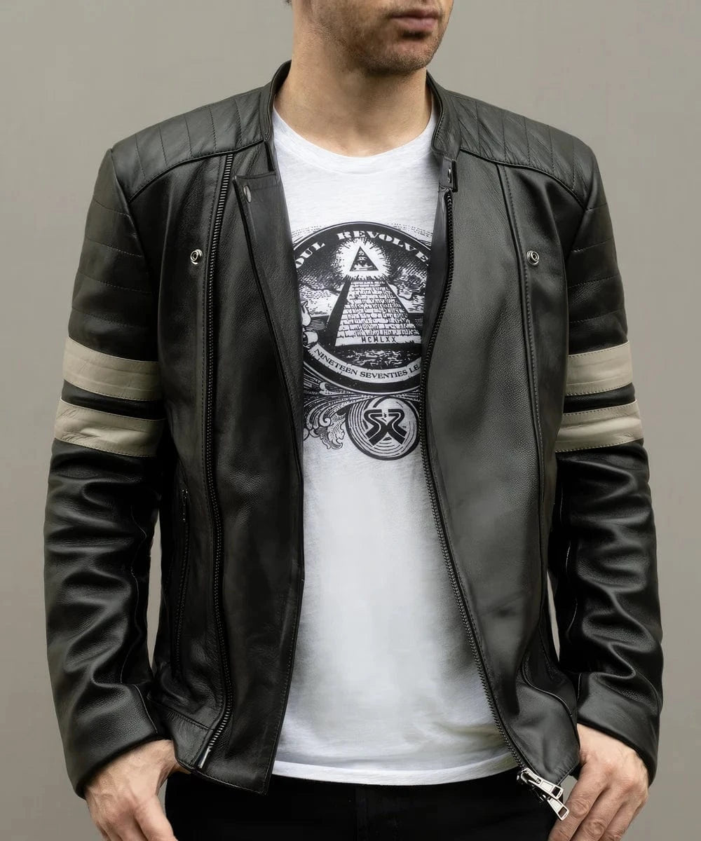 Male model wearing a black leather slim fit biker jacket with asymmetric zip front, quilted shoulders, silver sleeve stripes, and graphic white T shirt