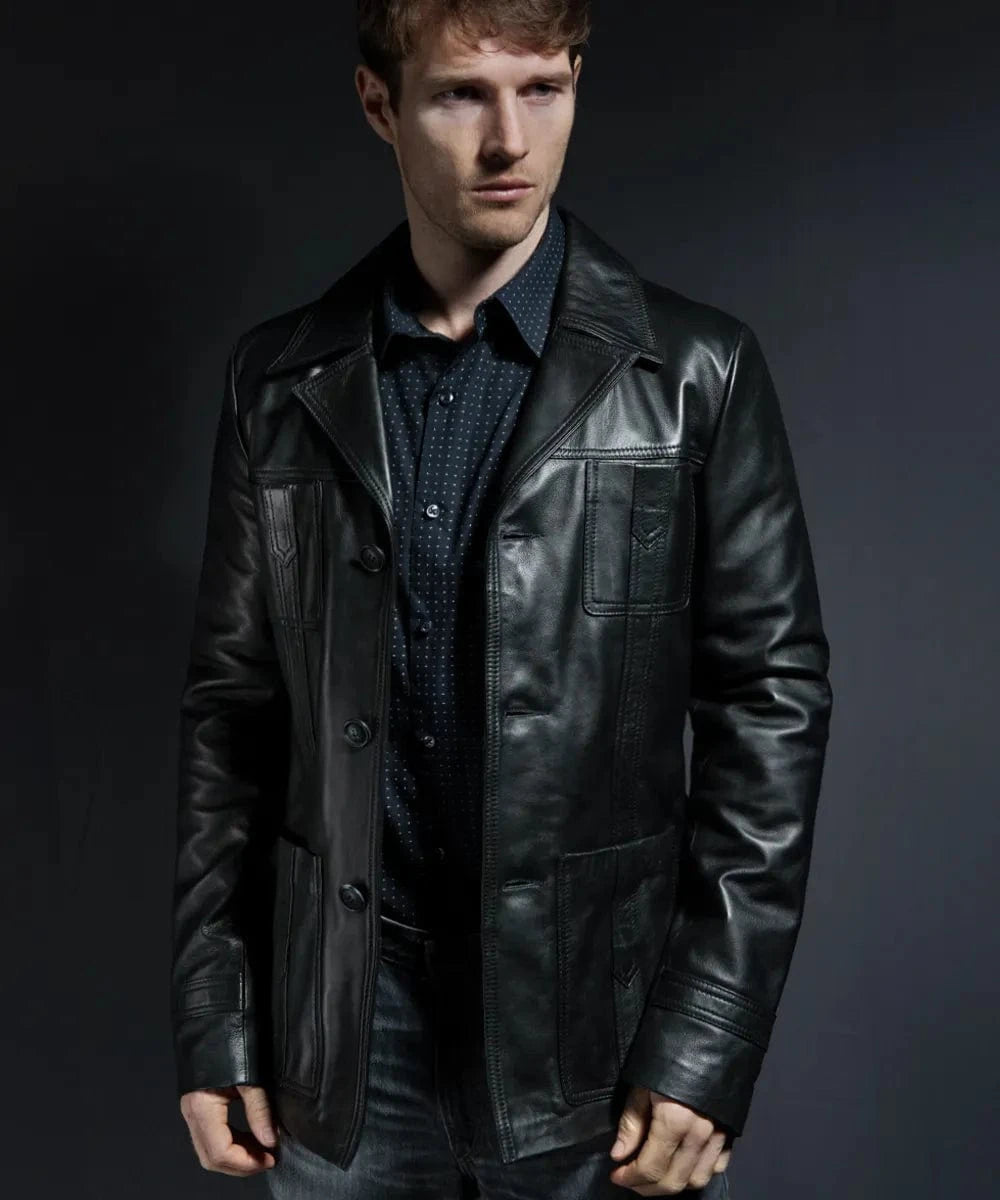 Male model wearing a black leather Life on Mars TV replica jacket with slim fit styling, vintage wide collar, button front closure, and retro utility pocket detailing