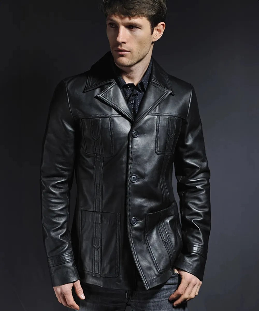 Male model wearing a black leather Life on Mars TV replica jacket with slim fit styling, vintage wide collar, button front closure, and retro 1970s inspired detailing