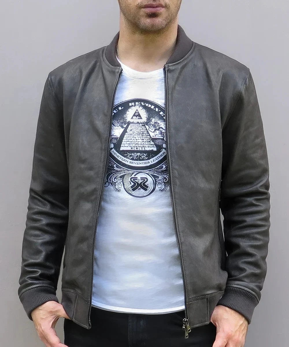 Model wearing vintage grey leather bomber jacket with slim fit styling and ribbed knit trim