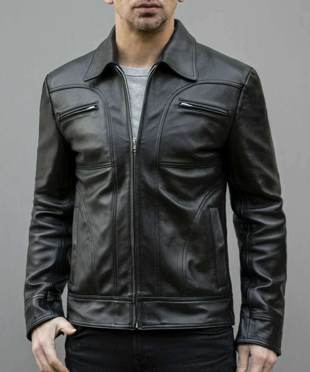 Model wearing vintage black leather jacket with slim fit styling and zip chest pocket detailing