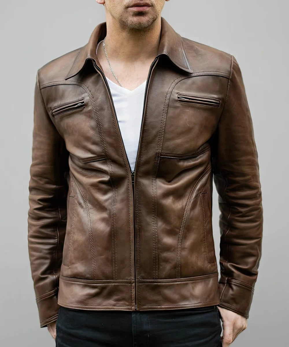 Model wearing vintage brown leather jacket with slim fit styling and zip chest pocket detailing