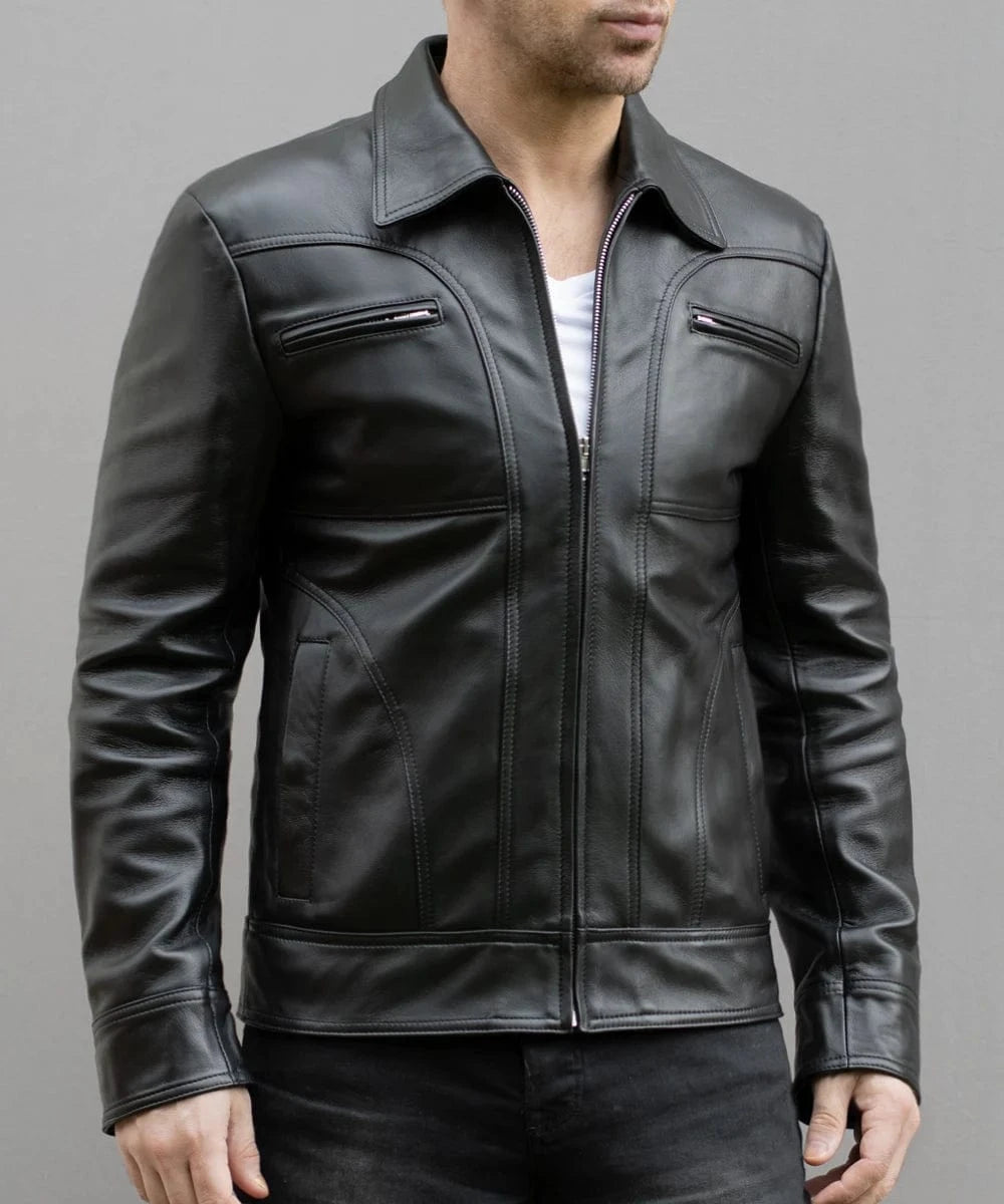 Model wearing vintage black leather jacket with slim fit styling and zip chest pocket detailing