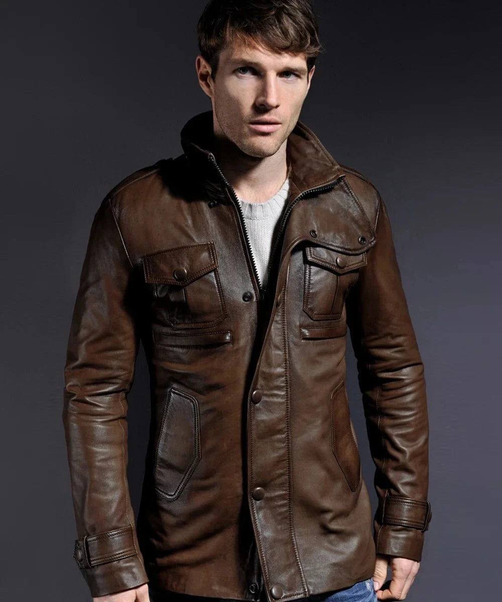 Model wearing vintage brown leather field jacket with slim fit styling and utility pocket detailing