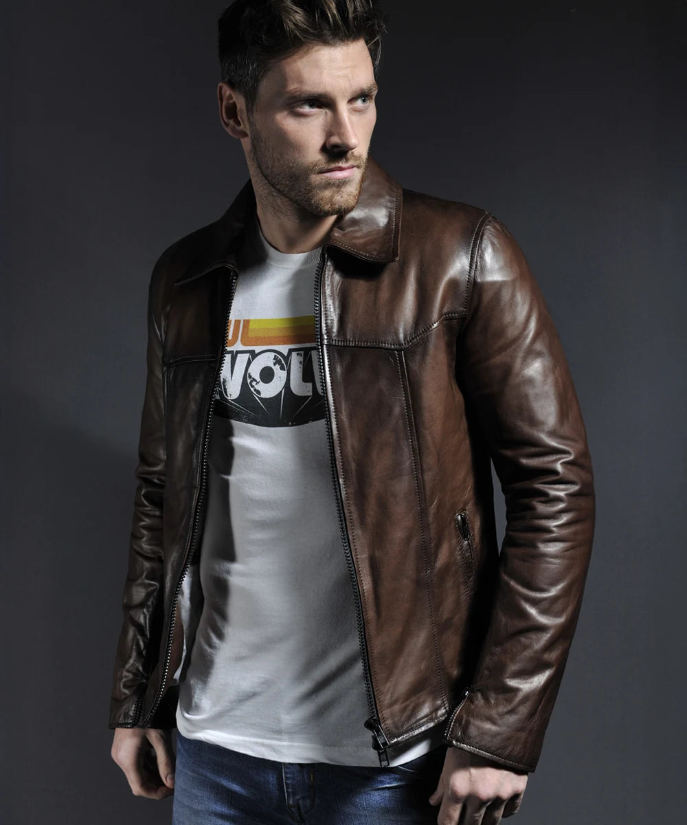 Model wearing vintage brown leather jacket with slim fit styling and distinctive seam detailing