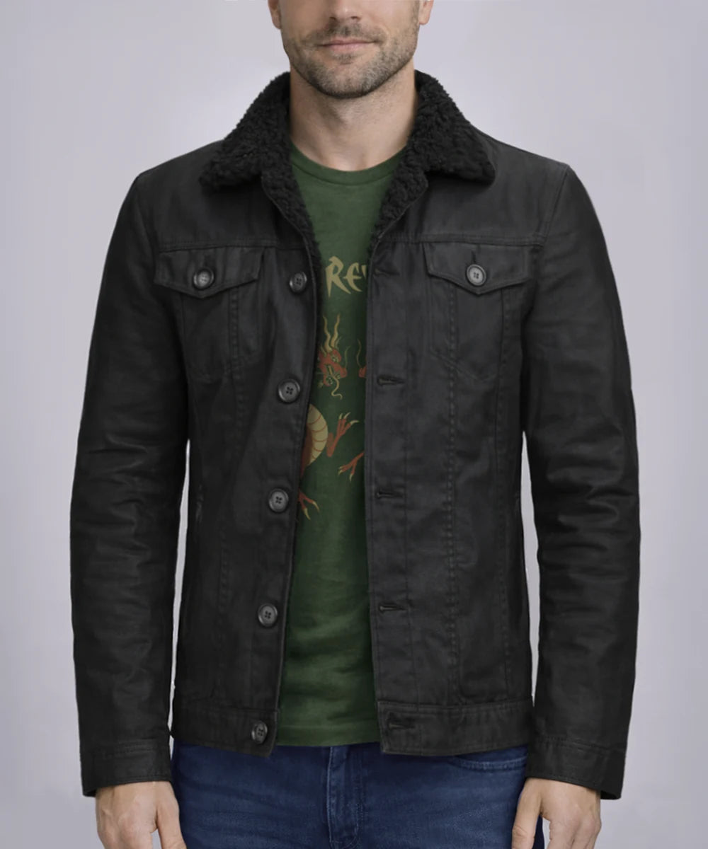 Model wearing men's black cotton jacket with slim fit vintage styling, shearling collar, and classic trucker inspired design